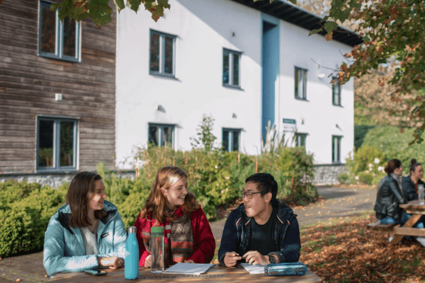 Students sat outside Penryn Campus accommodation.