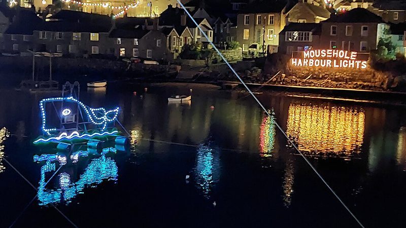 Mousehole harbour at Christmas.