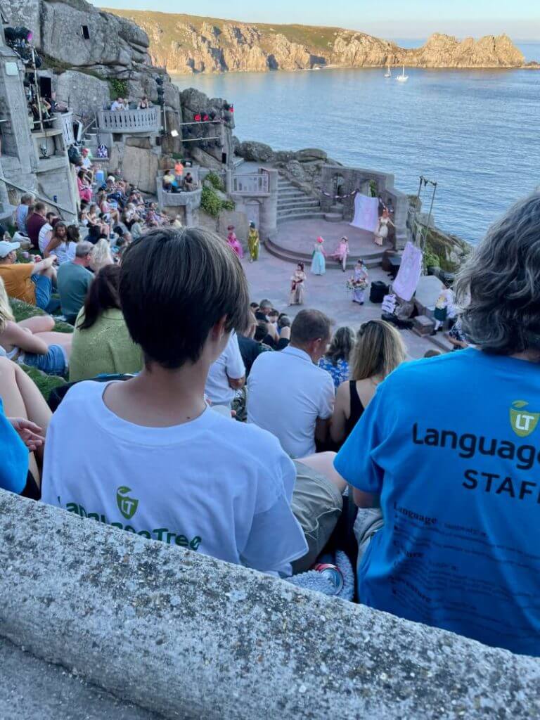 Language Tree staff and students watching a performance at the Minack theatre.