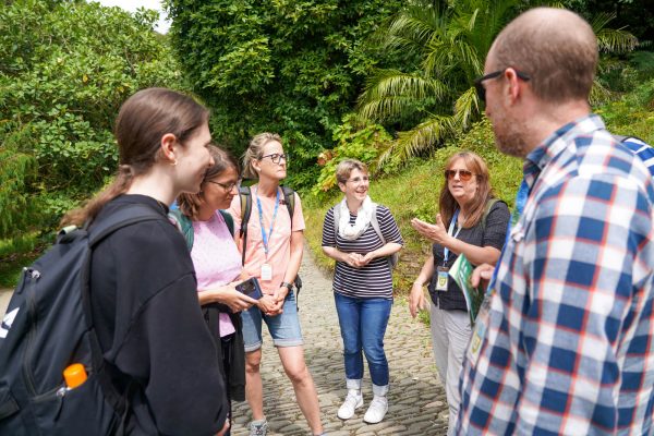 Language Tree staff explaining the history of Glendurgan Gardens