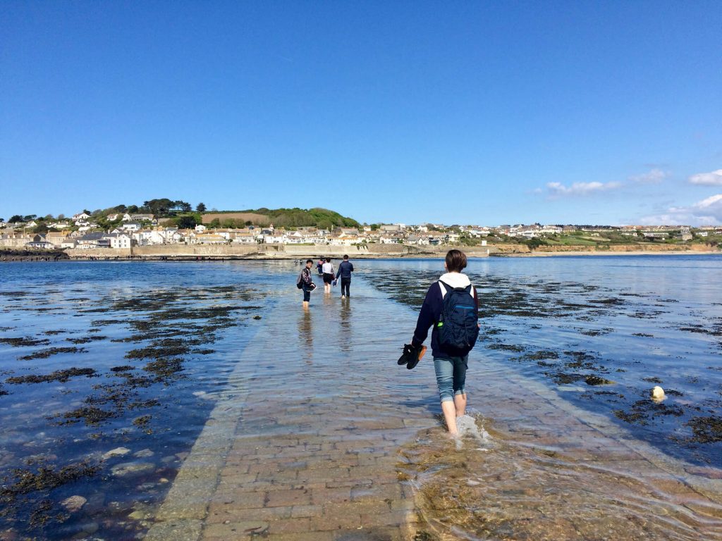Language Tree students walking the causeway at St Michael's Mount as the tide comes in