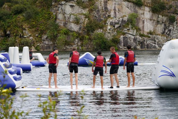 Students chatting on the inflatables at Kernow Adventure Park